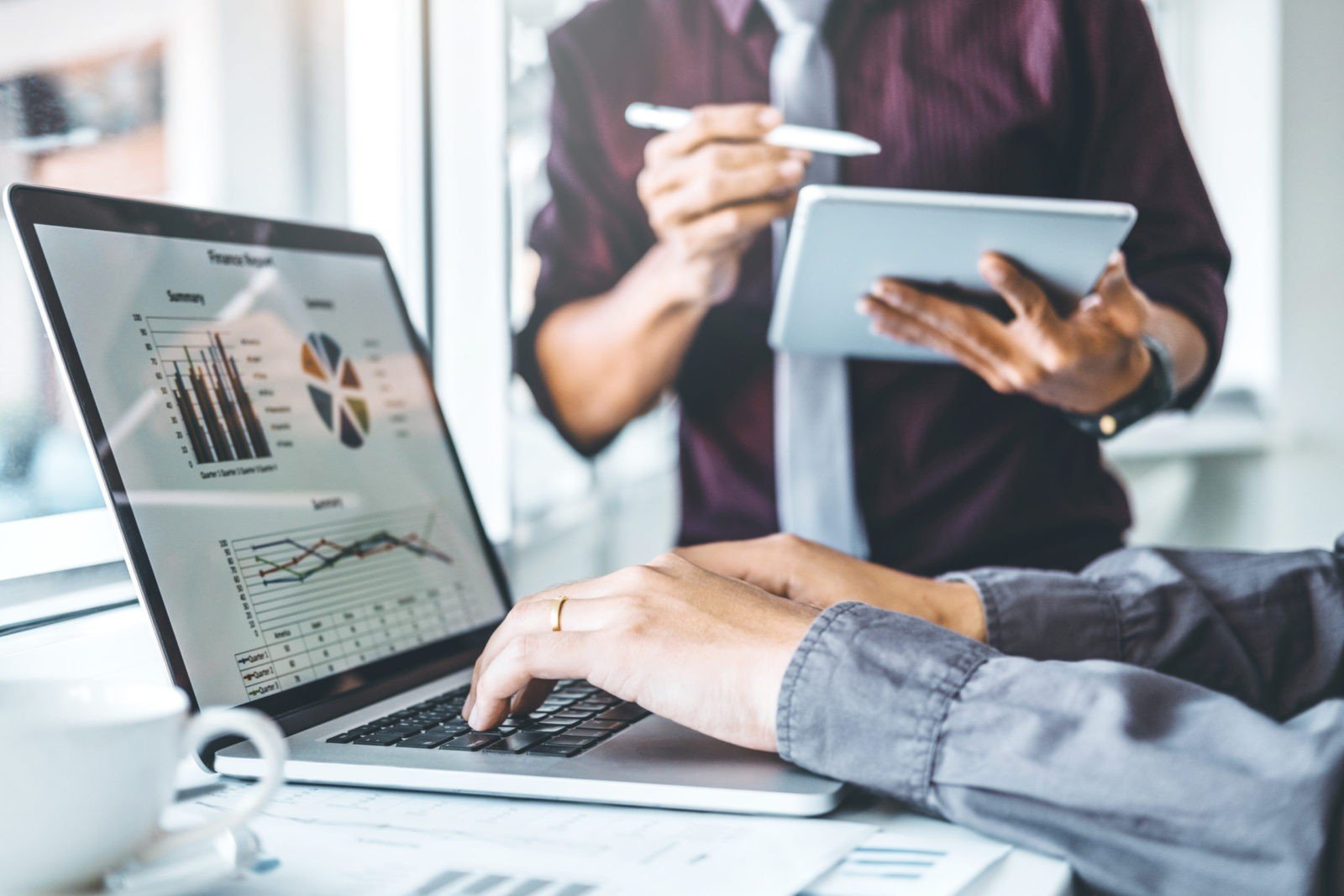 Co-working Business Team meeting Planning Strategy Analysis investment and saving concept. meeting discussing new plan financial graph data on Laptop.